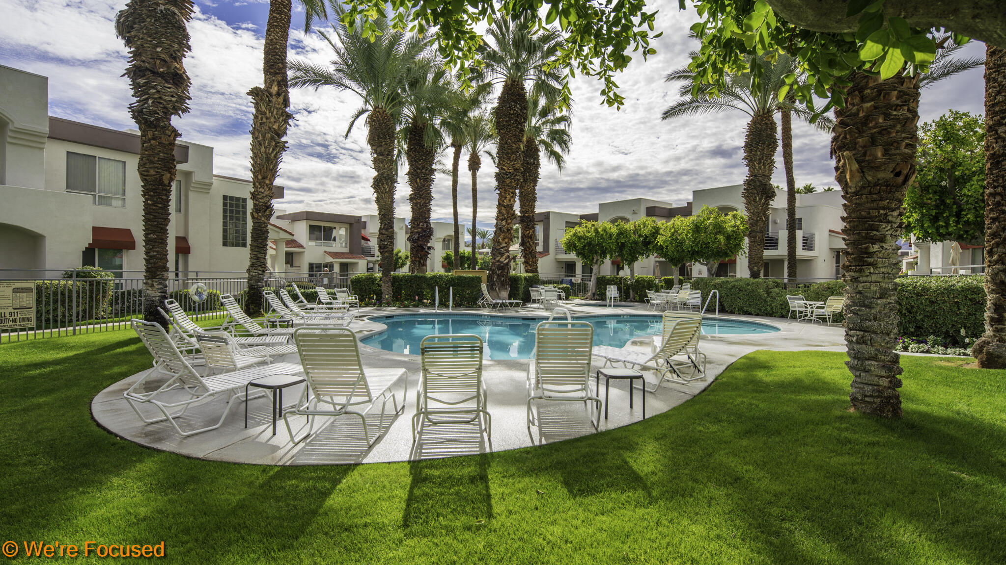 401 El Cielo Road, Unit 236 Palm Springs, CA 92262 - Photo 23 of 29 a view of a fountain in a yard with palm trees