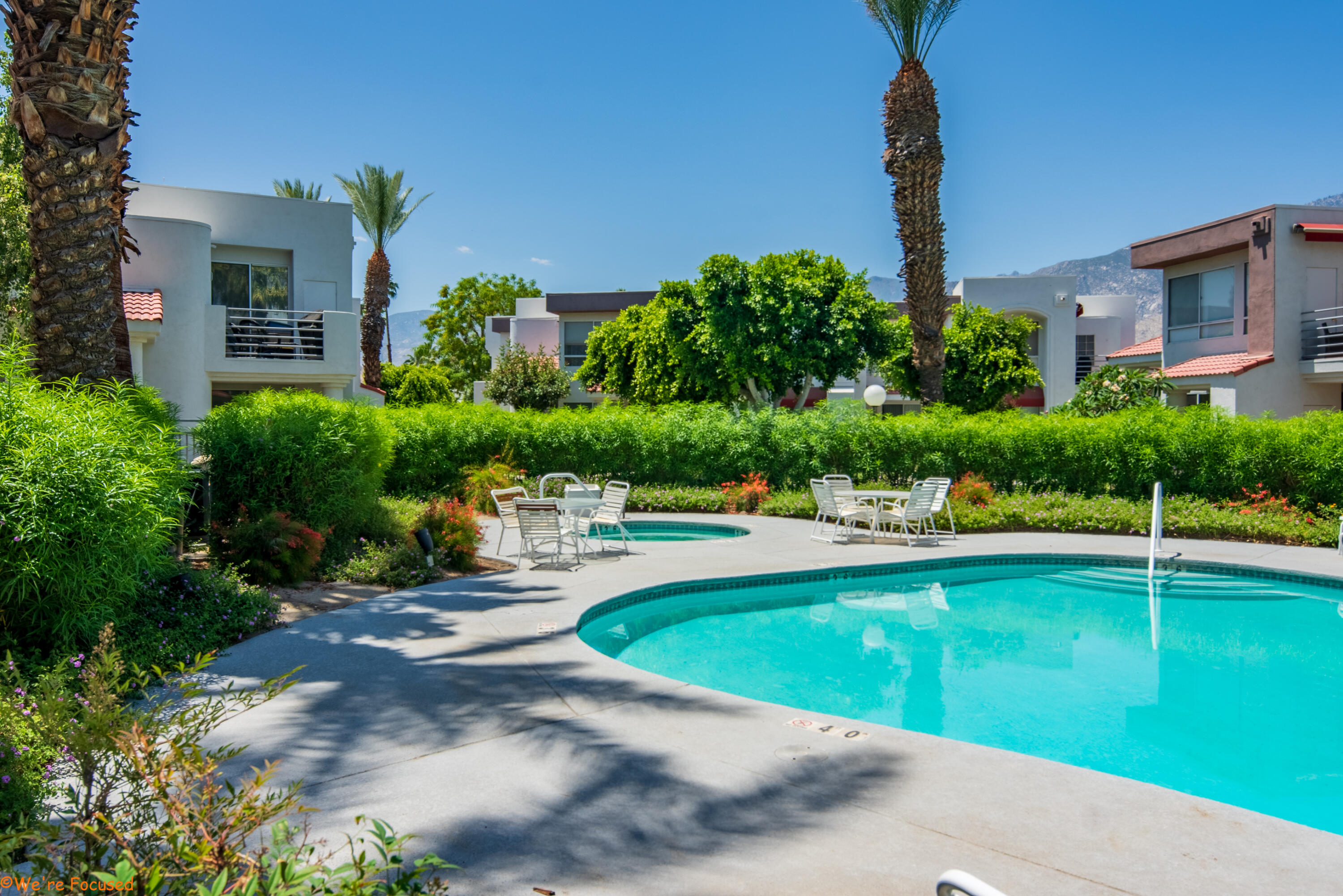 401 El Cielo Road, Unit 236 Palm Springs, CA 92262 - Photo 26 of 29 a view of a swimming pool with a patio