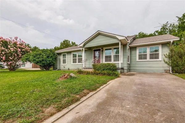 front view of a house with a yard
