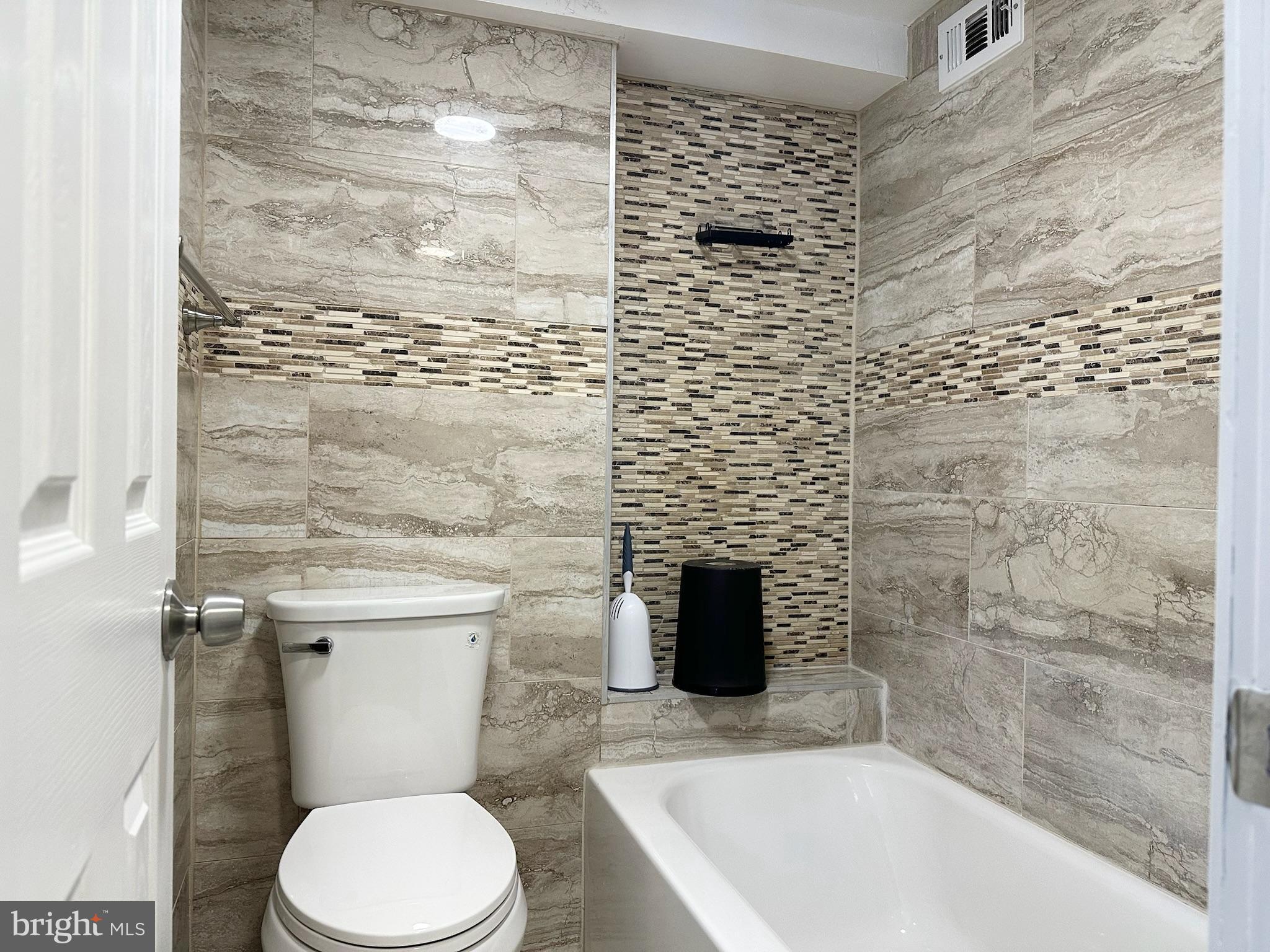 1836 Metzerott Road, Unit 901 Hyattsville, MD 20783 - Photo 15 of 25 Modern bathroom with elegant tile accents.