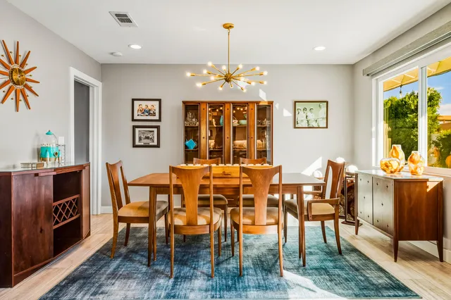 a view of a dining room with furniture window and outside view