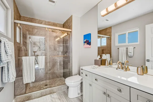 a view of a sink a table and a window