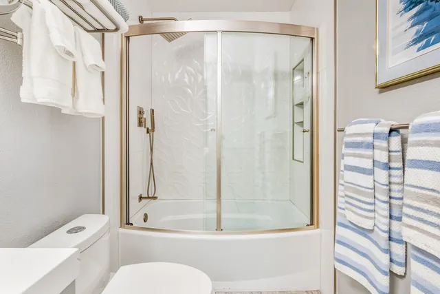 a view of a house with a yard potted plants