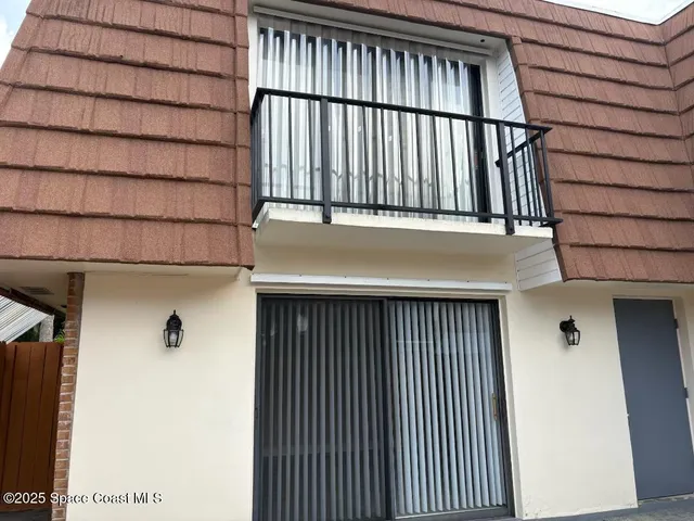 a view of staircase with a white fence