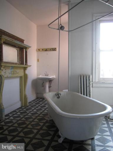 1242 Columbia Road Northwest Washington, DC 20009 - Photo 22 of 29 a bathroom with a sink and bathtub