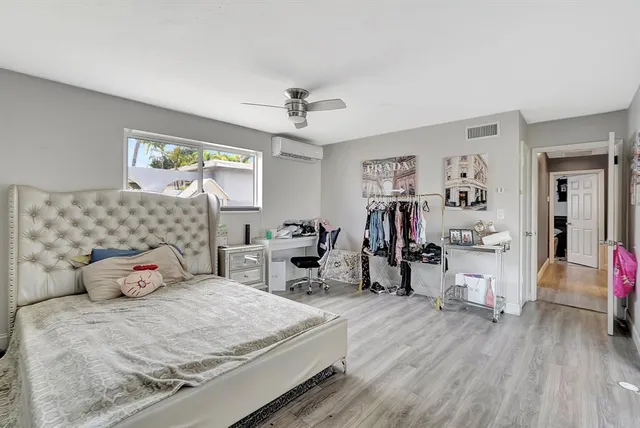 a view of a hallway view with wooden floor and staircase