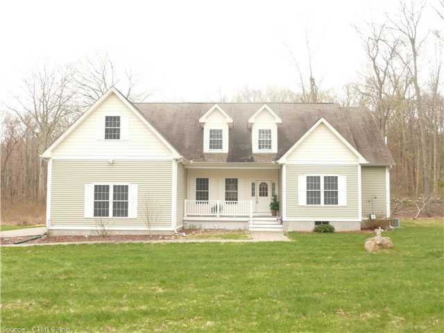 177 Flanders Road Stonington, CT 06378 - Photo 1 of 1 a front view of a house with a yard