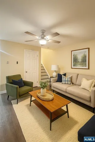 a living room with furniture and a table