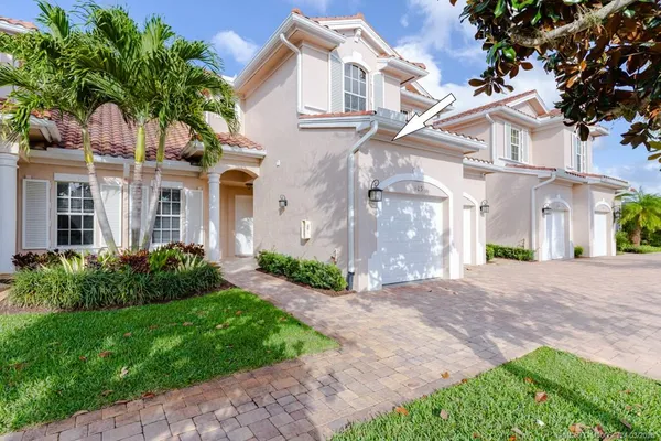 an aerial view of a house with a garden