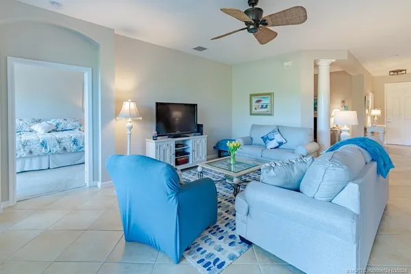 a kitchen with stainless steel appliances granite countertop a stove top oven a sink a dining table and chairs