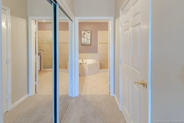 a bath tub sitting next to a bathroom sink