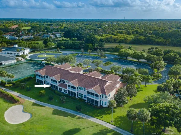 a street sign on a wall next to a road