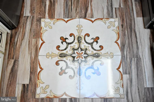 a living room with furniture a fireplace and a window