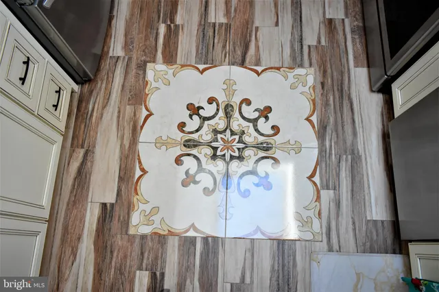 a living room with furniture rug and window