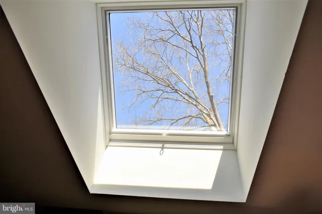 a living room with furniture window and wooden floor