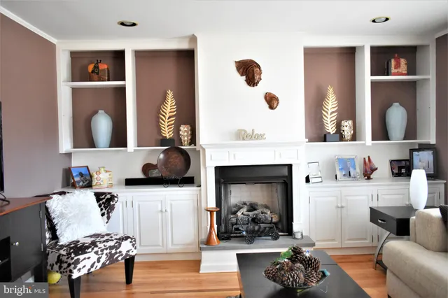 an empty room with wooden floor and a window
