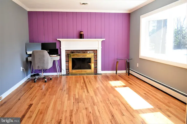 a bathroom with a toilet a sink and a window