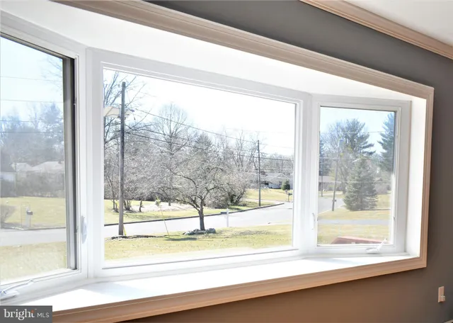 a view of a glass door with a floor to ceiling window