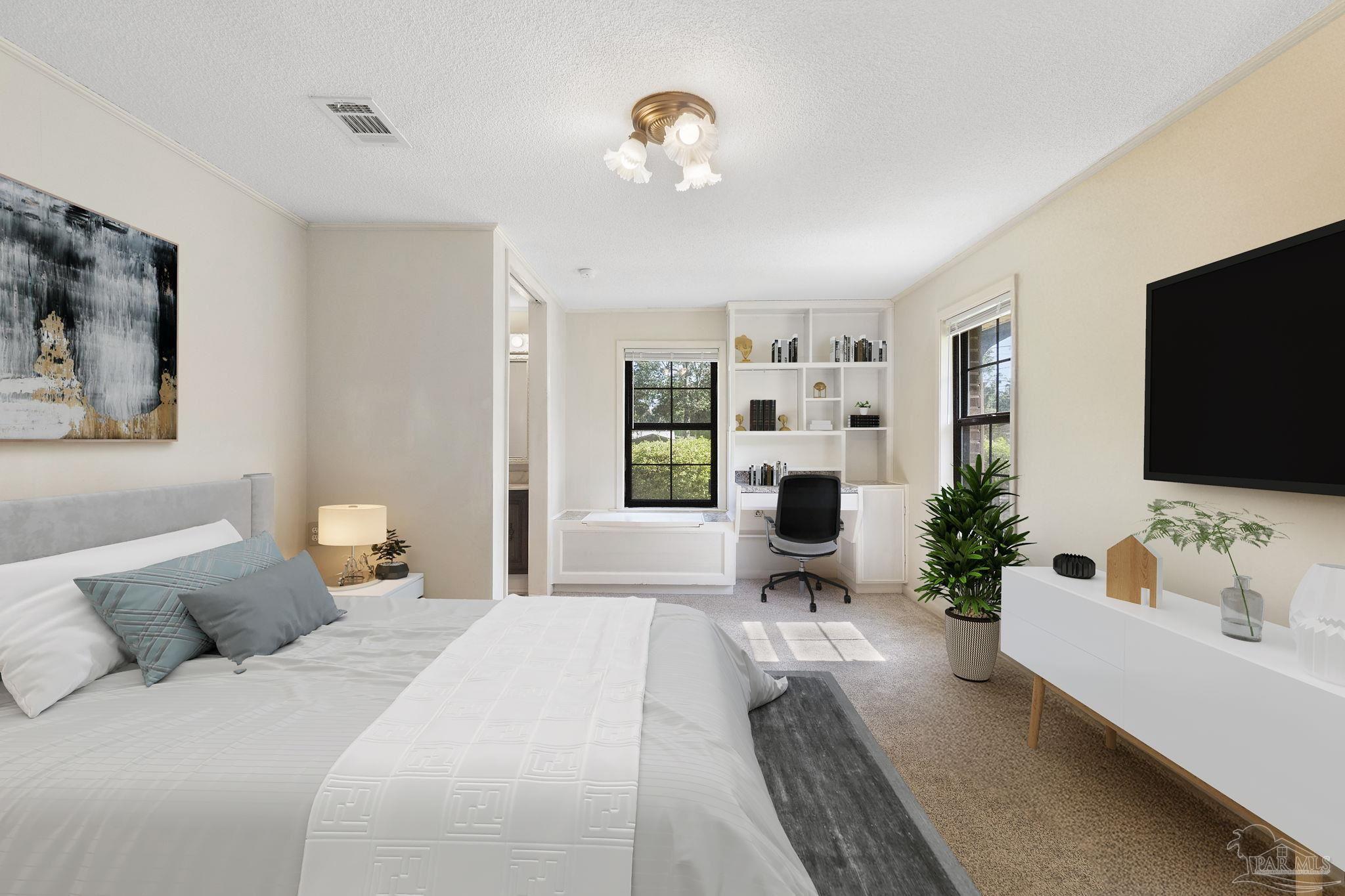 4285 7th Avenue Pace, FL 32571 - Photo 19 of 59 a bedroom with a bed and a flat screen tv