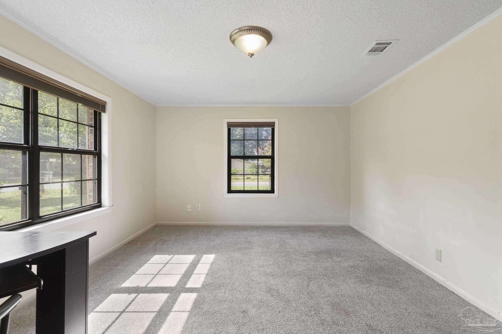 4285 7th Avenue Pace, FL 32571 - Photo 24 of 59 a view of an empty room with a window
