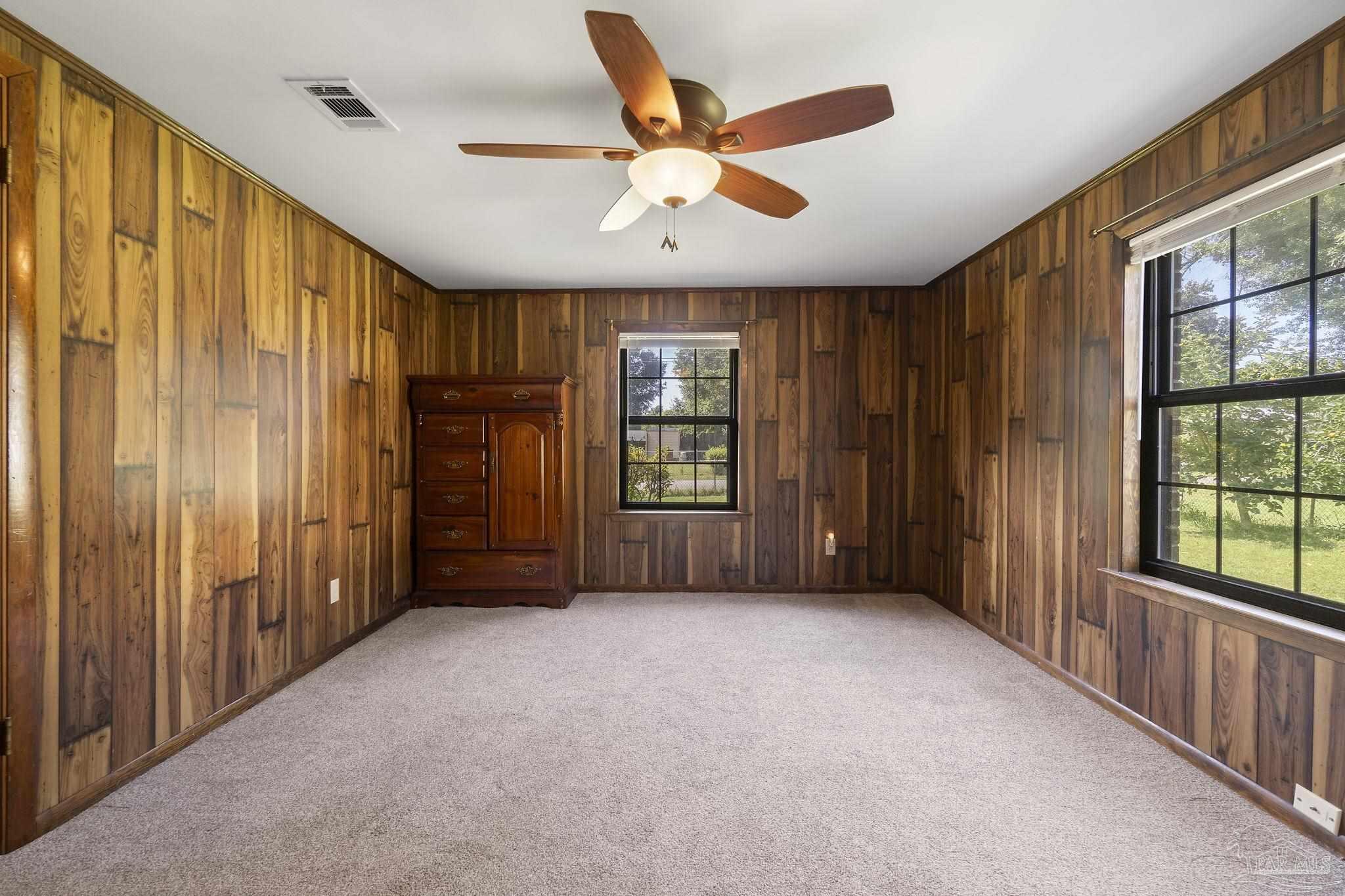 4285 7th Avenue Pace, FL 32571 - Photo 29 of 59 a view of an empty room with a window