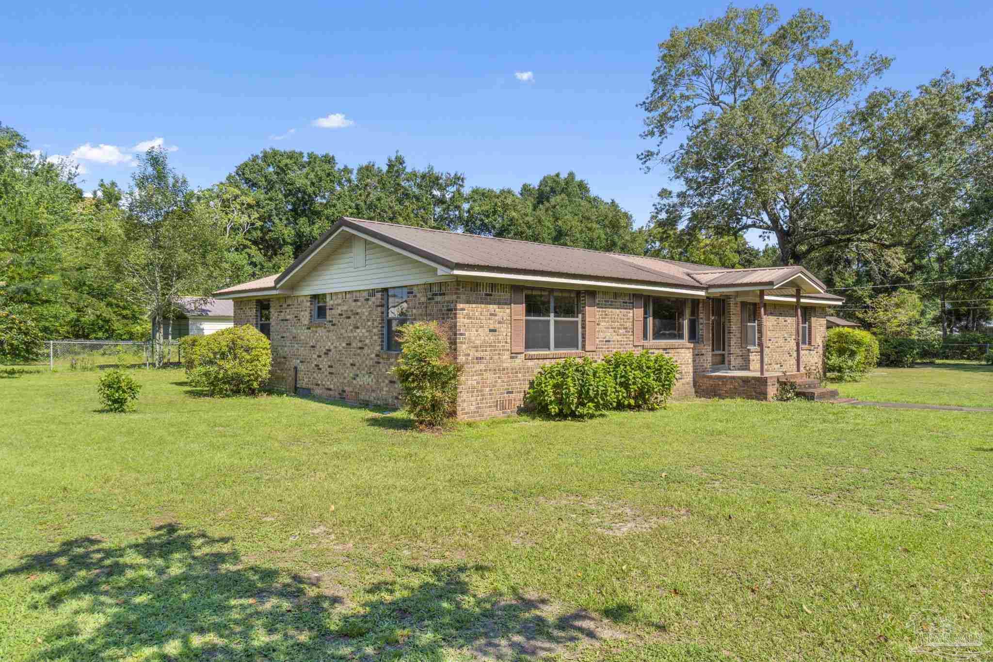 4285 7th Avenue Pace, FL 32571 - Photo 3 of 59 a view of a house with a yard
