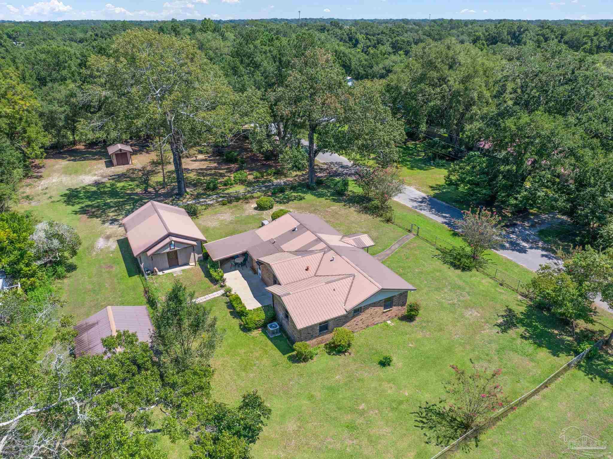 4285 7th Avenue Pace, FL 32571 - Photo 45 of 59 an aerial view of a house with garden space and street view