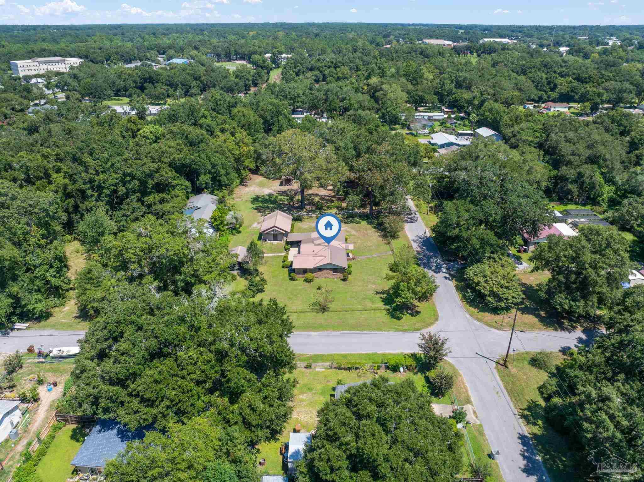 4285 7th Avenue Pace, FL 32571 - Photo 50 of 59 an aerial view of a house with a yard