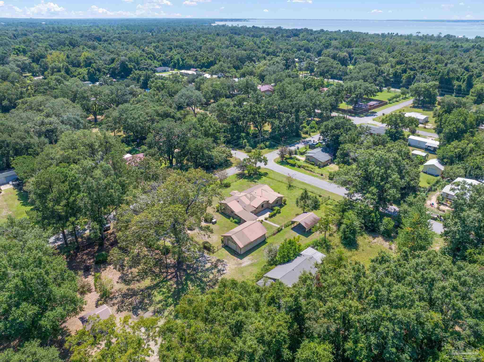 4285 7th Avenue Pace, FL 32571 - Photo 57 of 59 an aerial view of residential house with outdoor space and city view