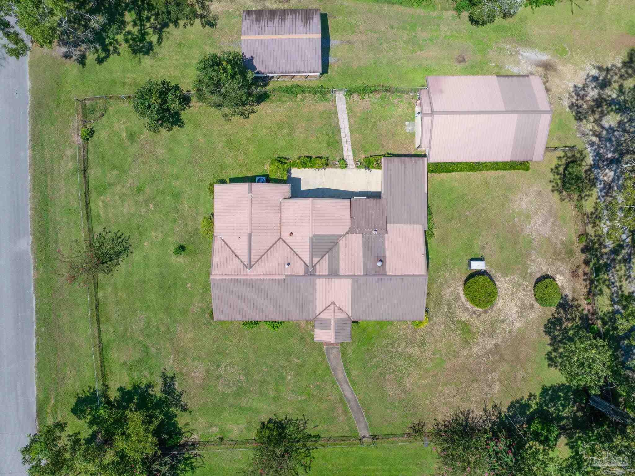 4285 7th Avenue Pace, FL 32571 - Photo 58 of 59 an aerial view of a house with a garden
