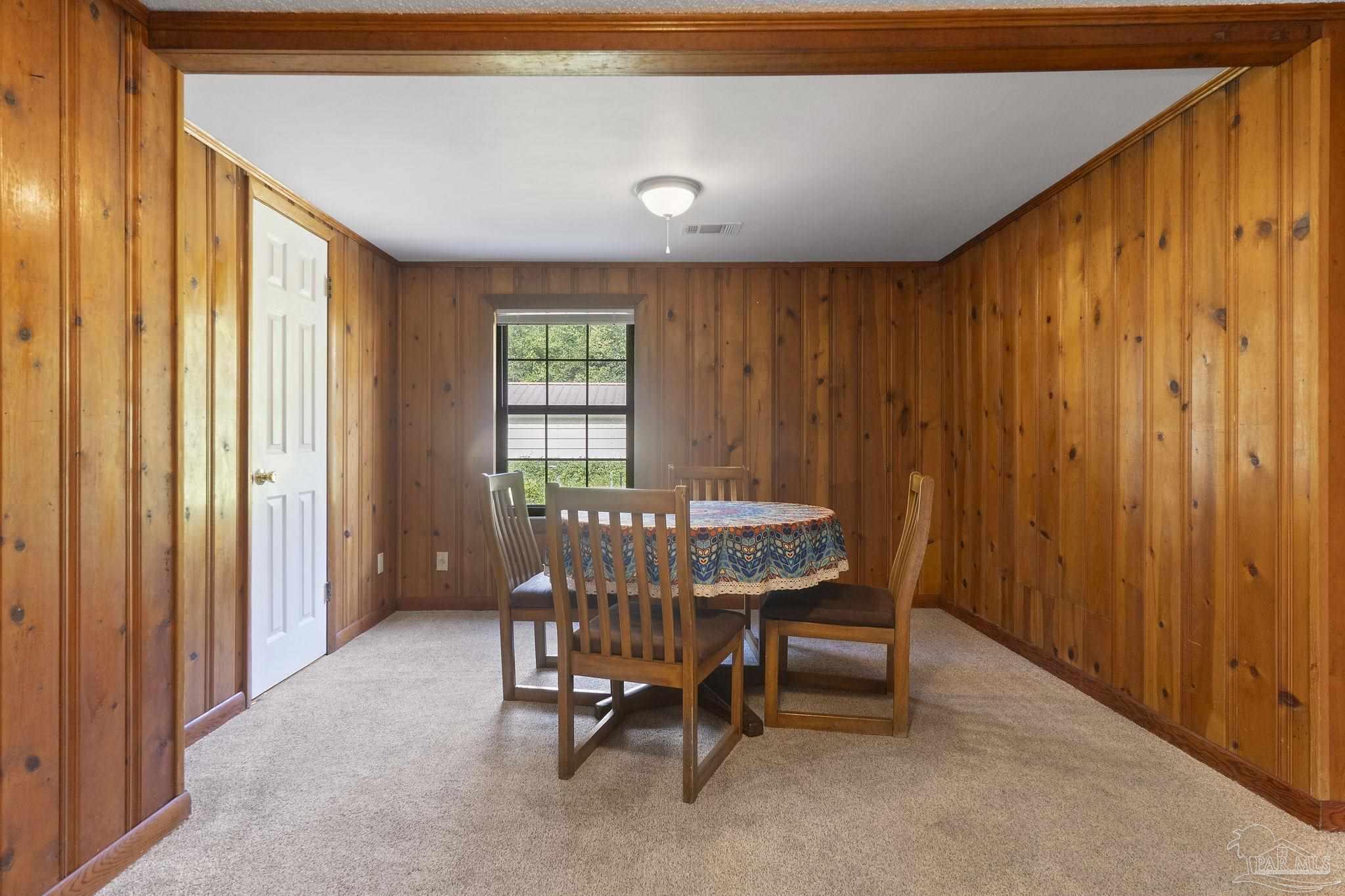 4285 7th Avenue Pace, FL 32571 - Photo 10 of 59 a view of a livingroom with furniture and a window