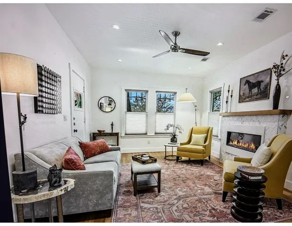 a living room with furniture or couch and a fireplace