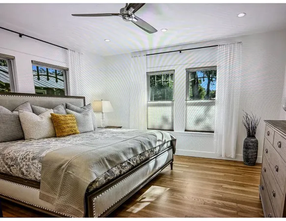 a spacious bedroom with a bed and a window