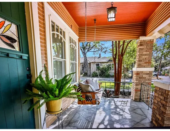 a view of a chair and tables in the patio