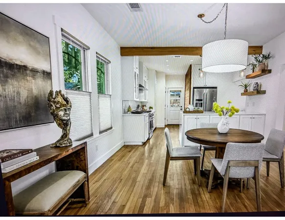 a view of a dining room with furniture window and outside view