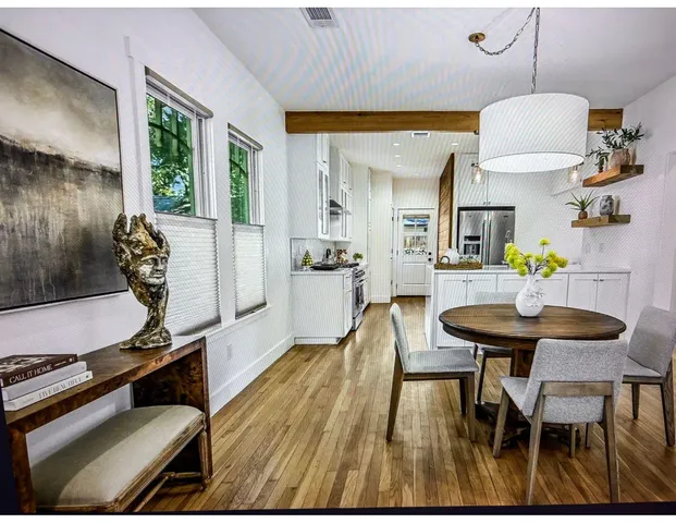 a view of a dining room with furniture window and outside view