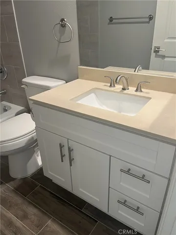 a bathroom with a sink and toilet