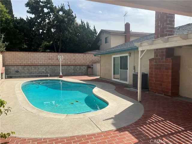 a house view with a swimming pool
