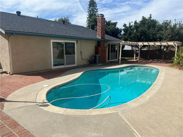 a view of a house with swimming pool