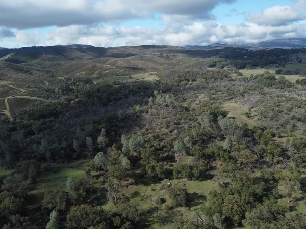 a view of a field of mountains and valleys