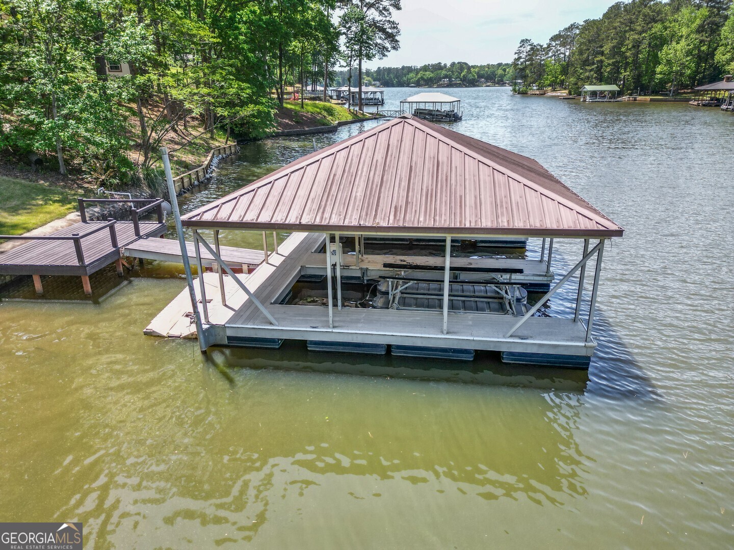71 Canvasback Court Monticello, GA 31064 - Photo 18 of 78 a small swimming pool is sitting in the backyard of house