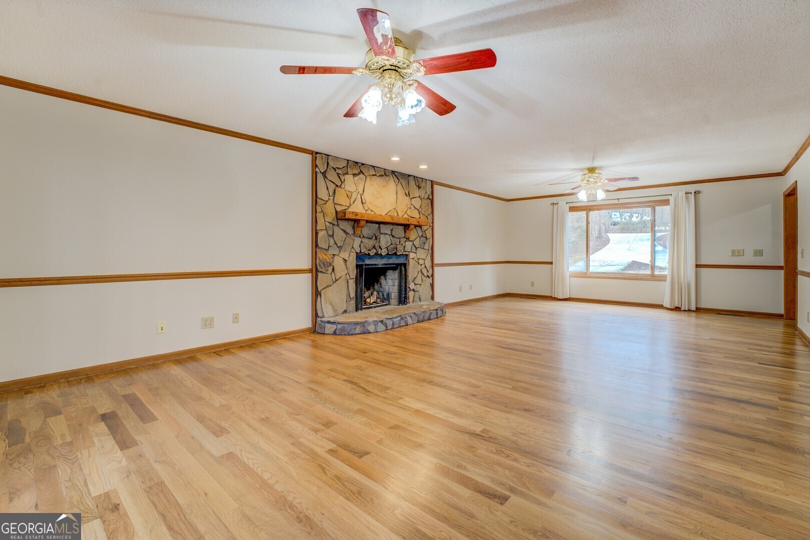 71 Canvasback Court Monticello, GA 31064 - Photo 23 of 78 wooden floor in an empty room with a window
