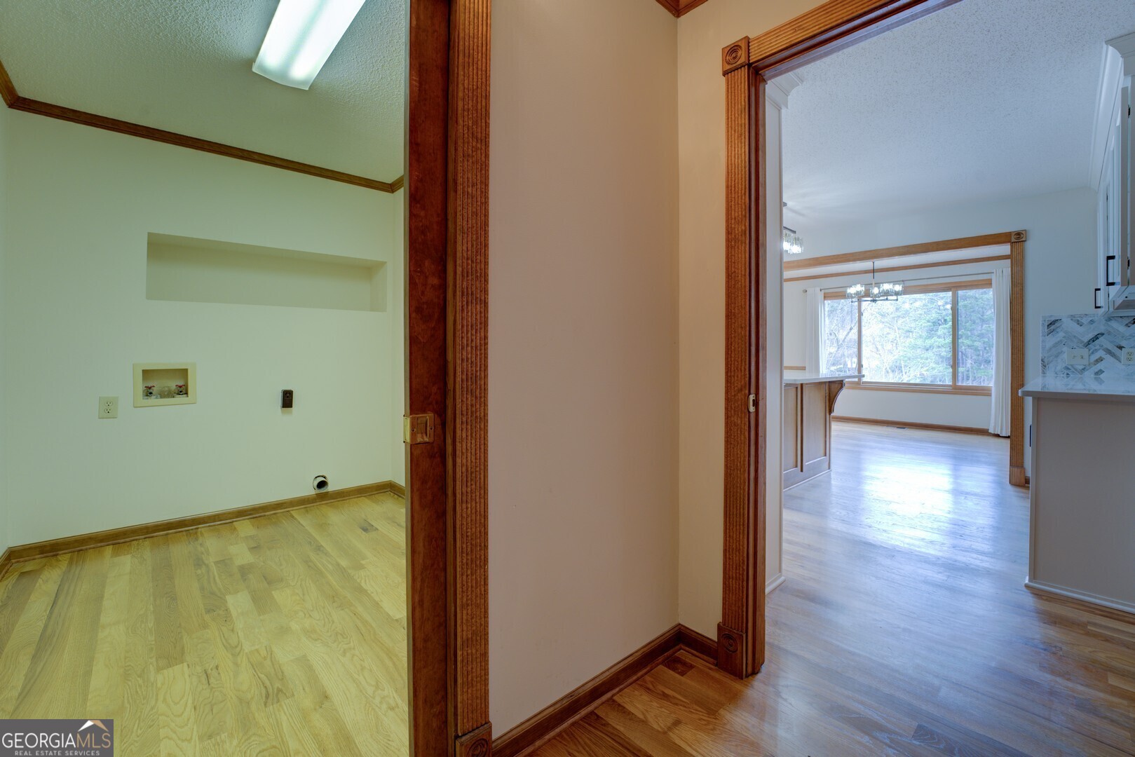 71 Canvasback Court Monticello, GA 31064 - Photo 38 of 78 a view of an empty room with wooden floor and a window