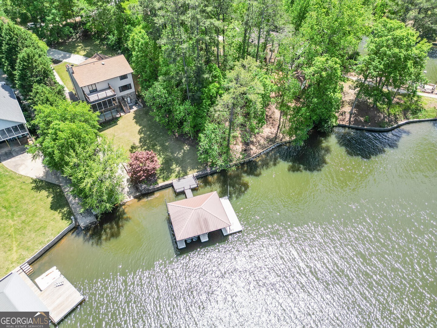 71 Canvasback Court Monticello, GA 31064 - Photo 4 of 78 an aerial view of a house with a garden and lake view