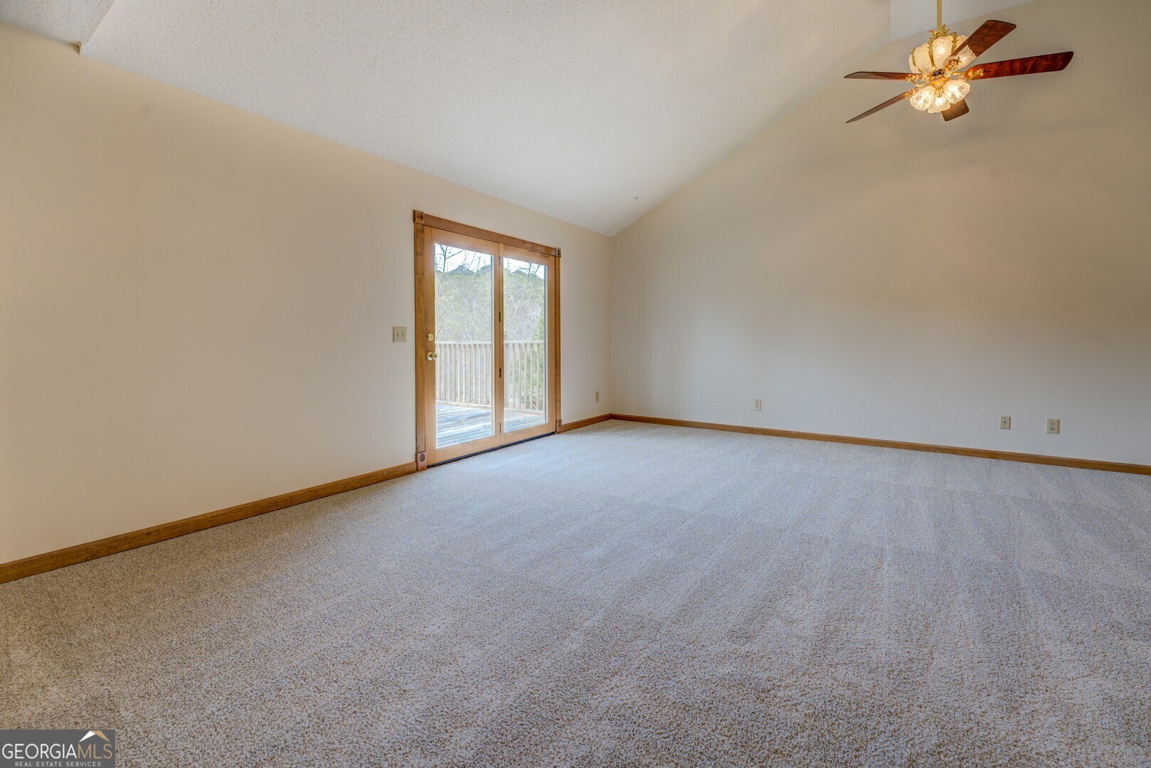 71 Canvasback Court Monticello, GA 31064 - Photo 43 of 78 an empty room with a window and a ceiling fan