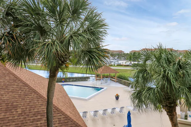 a view of a lake with a houses in the background