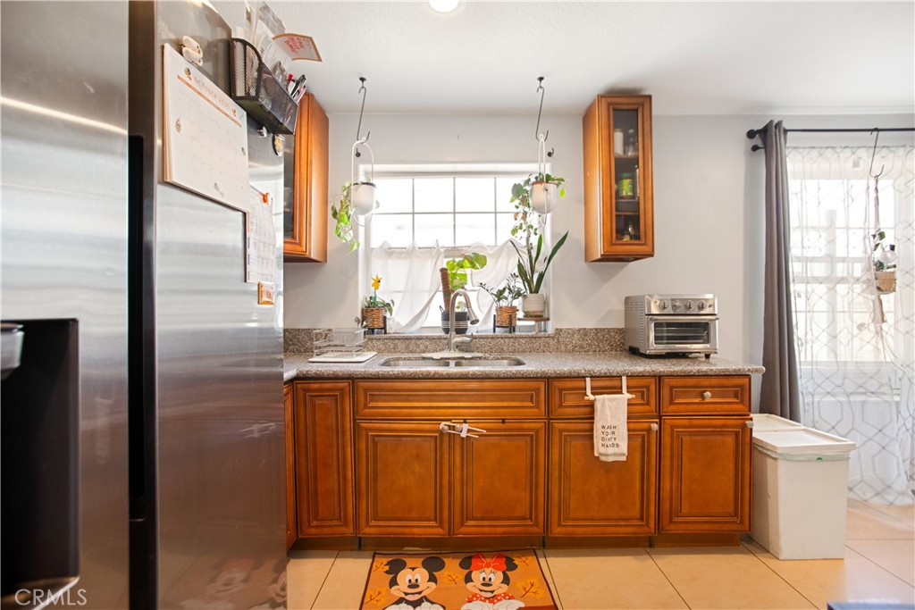 350 North Clifford Avenue Rialto, CA 92376 - Photo 10 of 18 a bathroom with a sink a mirror and a shower