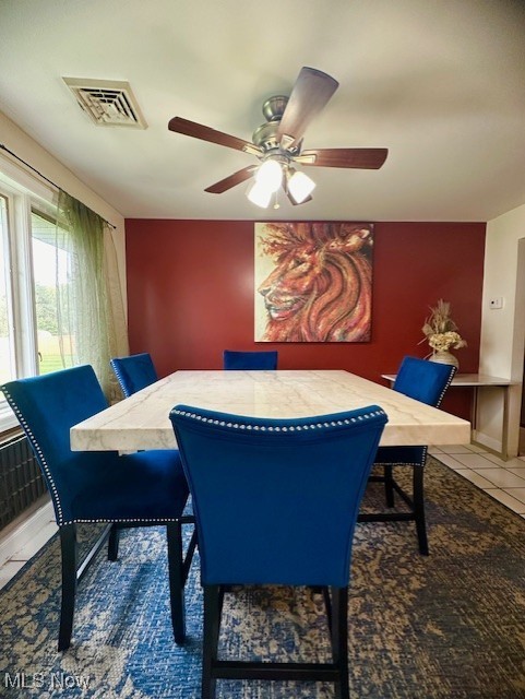 41810 Parsons Road Lagrange, OH 44050 - Photo 7 of 19 Dining area with dark tile patterned floors and ceiling fan