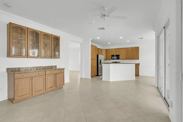 a view of a kitchen with a sink cabinets and a window