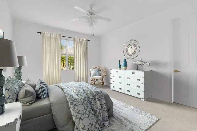 a bedroom with furniture and a window